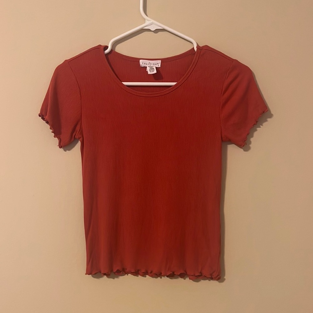 Precious girl’s top with cute ruffled detailing